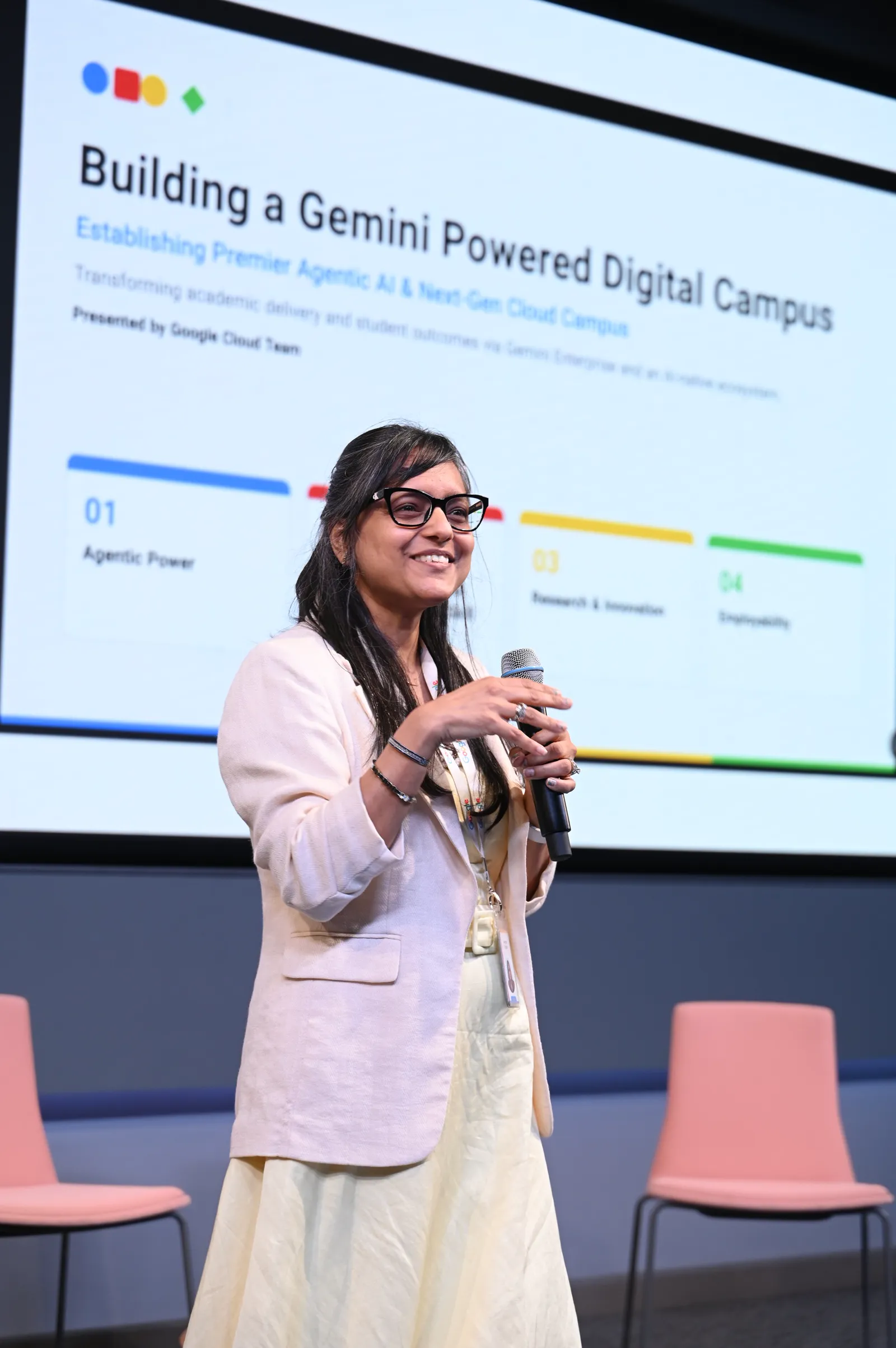 Speaker presenting 'Building a Gemini-powered Digital Campus' on stage